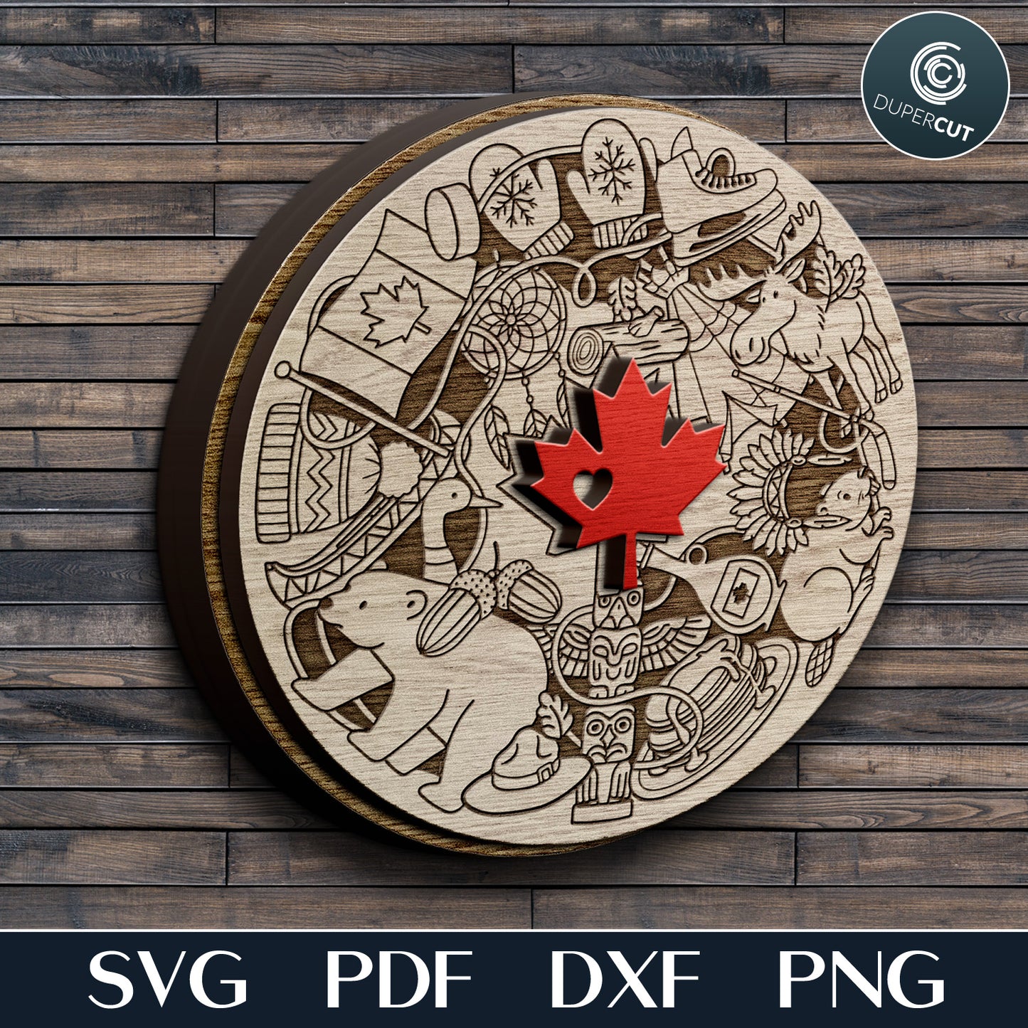 Wooden circular cutout with intricate designs and a red maple leaf on a wooden background, featuring the DuperCut logo.