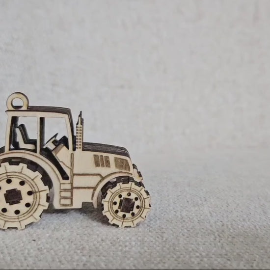 Mini Tractor fidget toy with moving wheels. Laser cut file for Glowforge, Xtool by www.dupercut.com